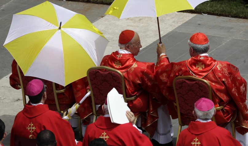 Cardinals shelter from the sun during a Pentecost Mass celebrated by Pope Francis in St. Peter's Square, at the Vatican, on June 9, 2019. The Pentecost Mass is celebrated on the seventh Sunday after Easter. (AP Photo/Gregorio Borgia)