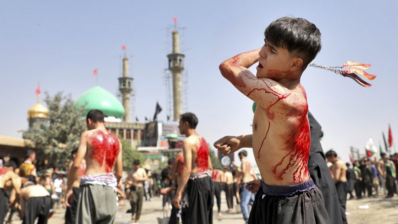 Afghan Shiites flagellate themselves with chains and blades to mark Ashura, outside the Abul Fazel Shrine in Kabul, Afghanistan, on Sept. 10, 2019. Ashoura falls on the 10th day of Muharram, the first month of the Islamic calendar, when Shiites mark the death of Hussein, the grandson of the Prophet Muhammad, at the Battle of Karbala in present-day Iraq in the 7th century. (AP Photo/Ebrahim Noroozi)