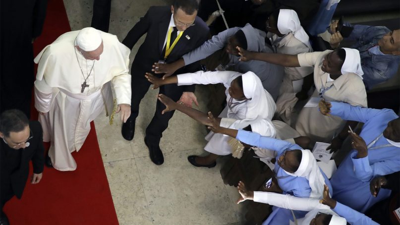 Nuns reach out for Pope Francis as he leaves after a meeting at the Cathedral of the Immaculate Conception, in Maputo, Mozambique, on Sept. 5, 2019. Francis met with Mozambique's priests and religious sisters at the capital's art deco Immaculate Conception cathedral to offer them encouragement in the face of the constant challenges of suffering, poverty and religious indifference. (AP Photo/Alessandra Tarantino)