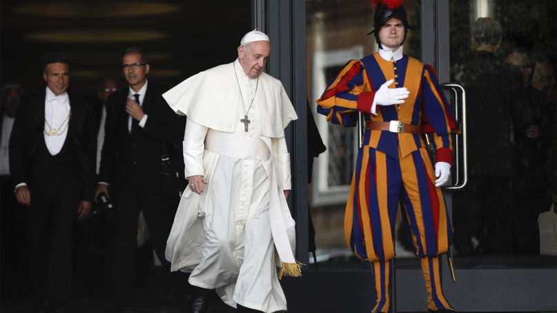 Pope Francis leaves the morning session of the Amazon synod, at the Vatican, Saturday, Oct. 12, 2019. Pope Francis is holding a three-week meeting on preserving the rainforest and ministering to its native people as he fended off attacks from conservatives who are opposed to his ecological agenda. (AP Photo/Alessandra Tarantino)