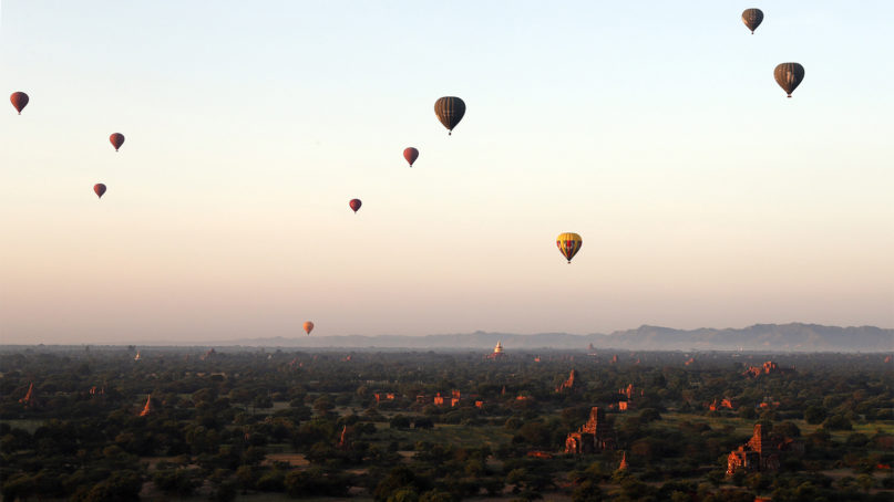 Hot air balloons fly over Myanmar's ancient temples just before the sunrise in old Bagan, Nyaung U district, central Myanmar, Thursday, Oct. 31, 2019. (AP Photo/Aung Shine Oo)