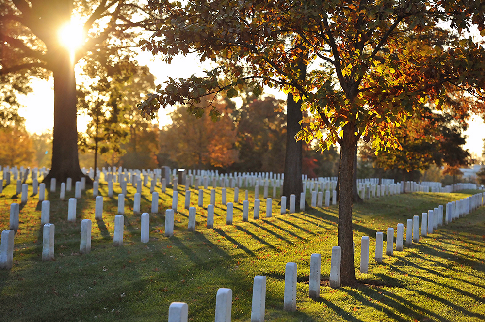 The sun rises over Arlington National Cemetery, Nov. 5, 2011. (U.S. Coast Guard photo by Petty Officer 2nd Class Patrick Kelley/Creative Commons)