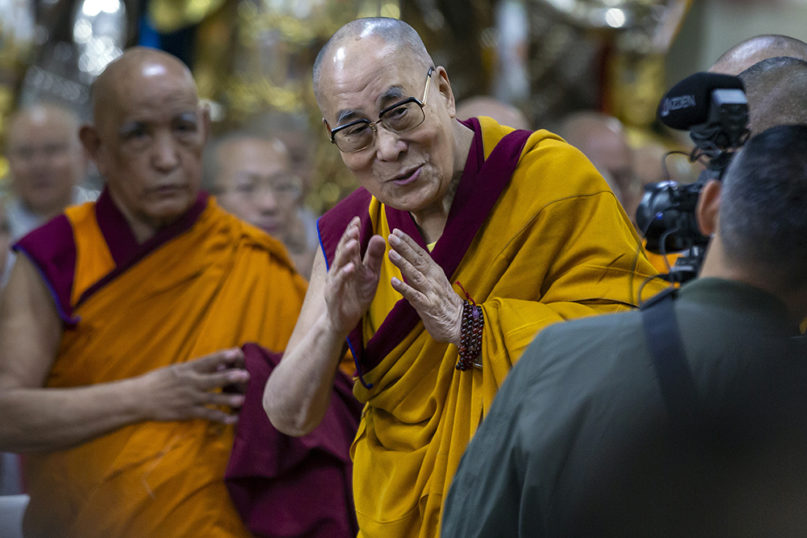 Tibetan spiritual leader the Dalai Lama greets devotees as he arrives to give a religious talk at the Tsuglakhang temple in Dharmsala, India, on Nov. 4, 2019.  (AP Photo/Ashwini Bhatia)