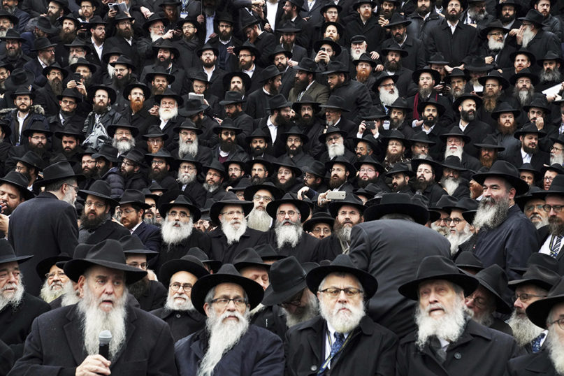 Hasidic leaders gather for an annual group photo outside of the Chabad-Lubavitch Worldwide headquarters as a part of the International Conference of Chabad-Lubavitch Emissaries in New York on Nov. 24, 2019. (AP Photo/Emily Leshner)