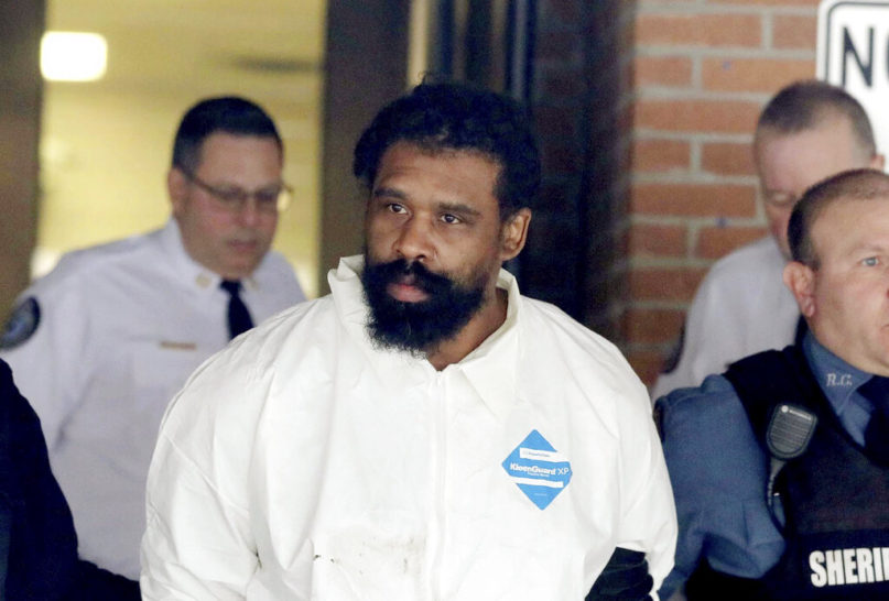 Grafton Thomas is led from Ramapo Town Hall in Ramapo, N.Y. following his arraignment Sunday, Dec. 29, 2019. Thomas was charged in the stabbings of multiple people as they gathered to celebrate Hanukkah at a rabbi's home in Monsey, an Orthodox Jewish community north of New York City.  (Seth Harrison/The Journal News via AP)