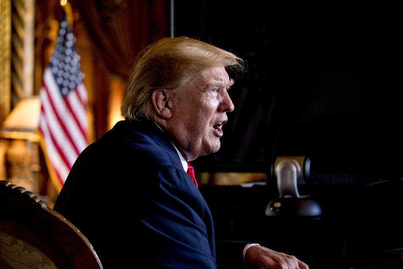 President Donald Trump speaks to the media after a Christmas Eve video teleconference with members of the military at his Mar-a-Lago estate in Palm Beach, Florida, on Dec. 24, 2019. (AP Photo/Andrew Harnik)