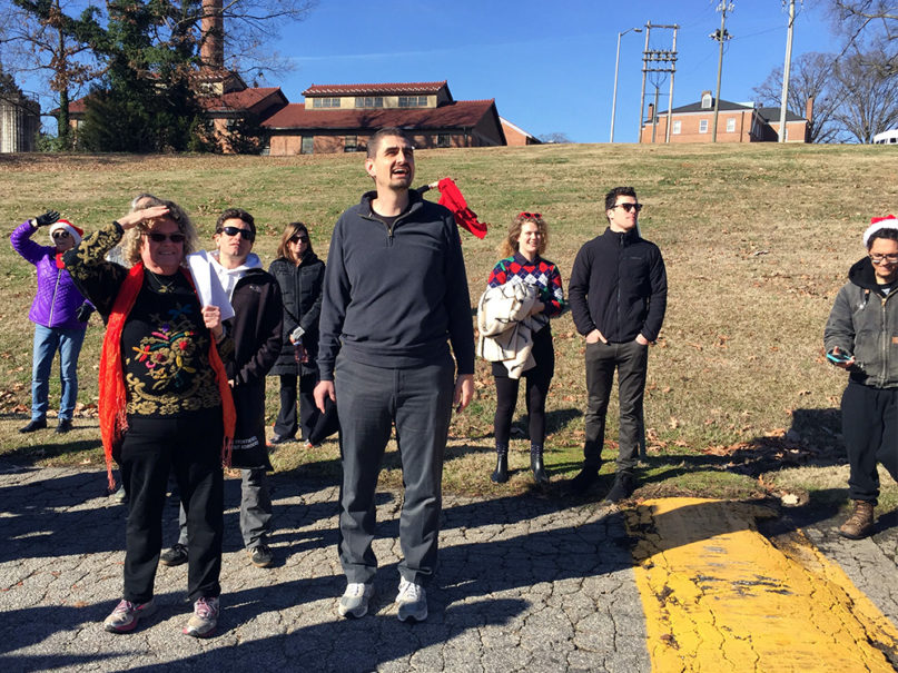Jonathan Wilson-Hartgrove, center, and others sing carols and yell holiday greetings outside Central Prison on Christmas Day, Dec. 25, 2019, in Raleigh, North Carolina. RNS photo by Yonat Shimron