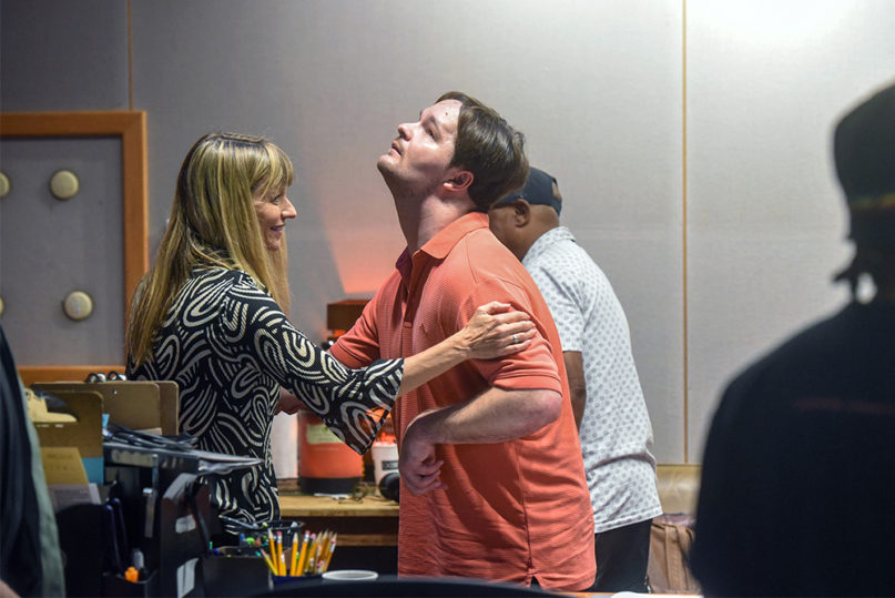 Luke Putney gets a hand from his mother, Nancy Hoddinott, in the Ocean Way Nashville Recording Studios in Nashville, Tennessee, on Aug. 19, 2019. Photo by Sam Simpkins/Belmont University