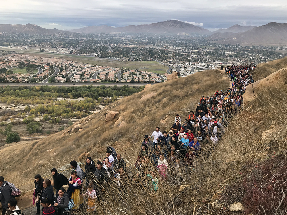 Hundreds of people hike up Mount Rubidoux, in Riverside, California, as part of a 2.5-mile pilgrimage to celebrate the Virgin Mary on Dec. 7, 2019. RNS photo by Alejandra Molina