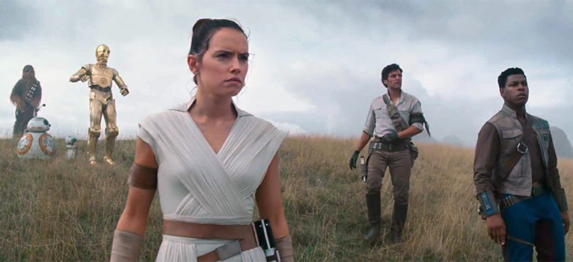 Actor Daisy Ridley as Rey, center, and other starring cast members in the new film, “Star Wars – Episode IX: The Rise of Skywalker.” Photo courtesy of Lucasfilm