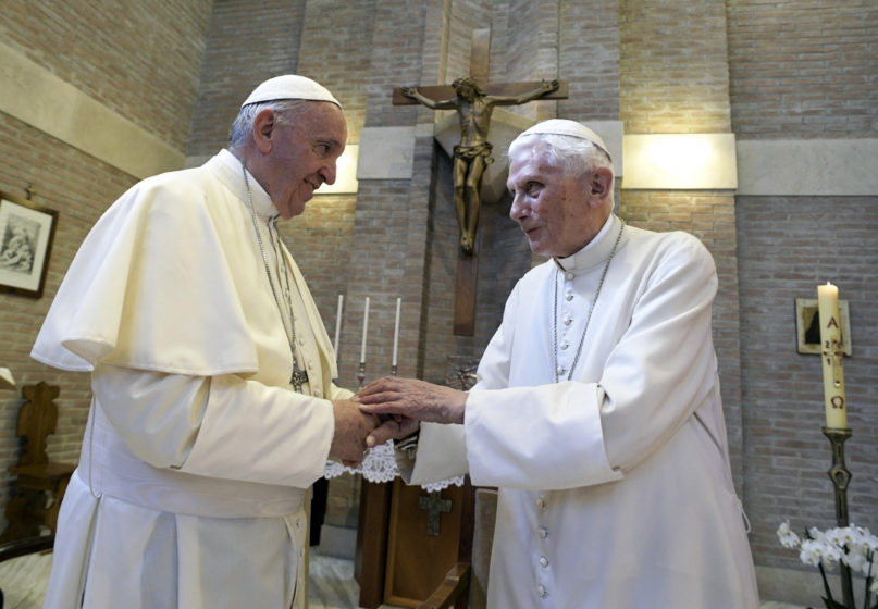 In this June 28, 2017, file photo, Pope Francis, left, and Pope Emeritus Benedict XVI meet on the occasion of the elevation of five new cardinals at the Vatican. (L'Osservatore Romano/Pool photo via AP, File)