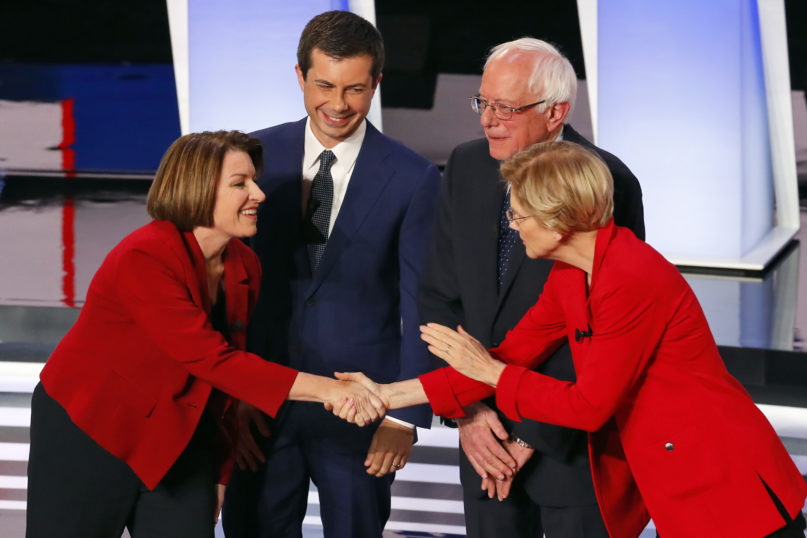 FILE - In this July 30, 2019, file photo, from left, Sen. Amy Klobuchar, D-Minn., South Bend Mayor Pete Buttigieg, Sen. Bernie Sanders, I-Vt., and Sen. Elizabeth Warren, D-Mass., greet each other before the first of two Democratic presidential primary debates hosted by CNN at the Fox Theatre in Detroit. Democratic presidential hopefuls are offering different approaches to the central challenge of how to talk about the polarizing debate over abortion. (AP Photo/Paul Sancya, File)
