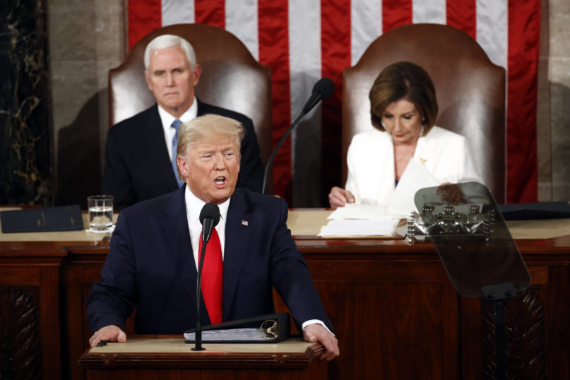 President Donald Trump delivers his State of the Union address to a joint session of Congress on Capitol Hill in Washington, Tuesday, Feb. 4, 2020, as Vice President Mike Pence and House Speaker Nancy Pelosi, D-Calif., watch. (AP Photo/Patrick Semansky)