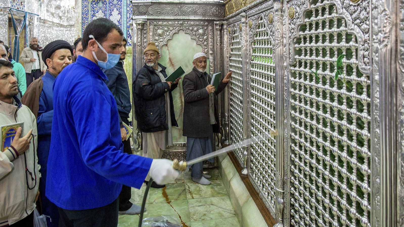 Iranian clerics keep shrines open, even as virus spreads