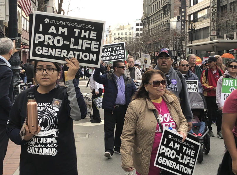 Thousands of abortion opponents march in the 15th annual Walk for Life across downtown San Francisco on Jan. 26, 2019. The event, which included a Roman Catholic Mass and a rally at Civic Center Plaza, was held close to the 46th anniversary of the U.S. Supreme Court's Roe v. Wade decision that legalized abortion. (AP Photo/Juliet Williams)