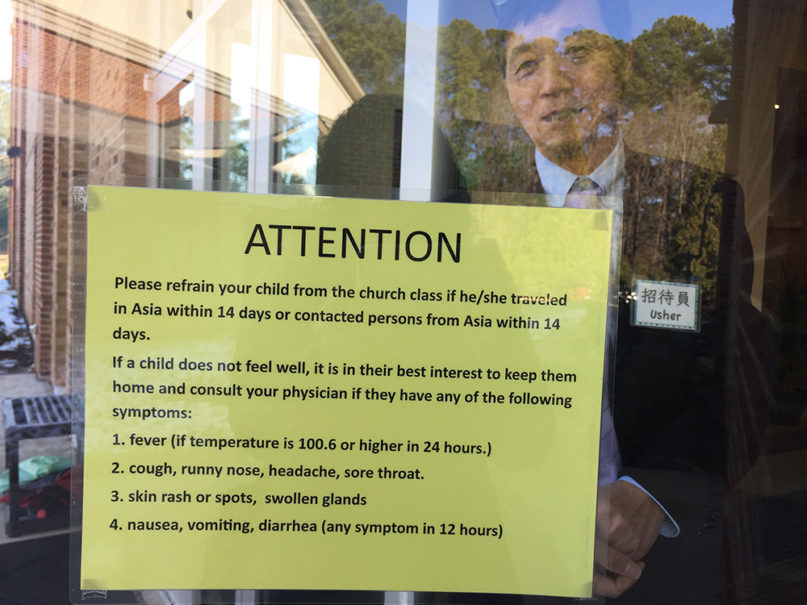 The sign outside the Raleigh Chinese Christian Church warns parents not to bring their children to church if they  traveled to Asia in the past two weeks. RNS photo by Yonat Shimron