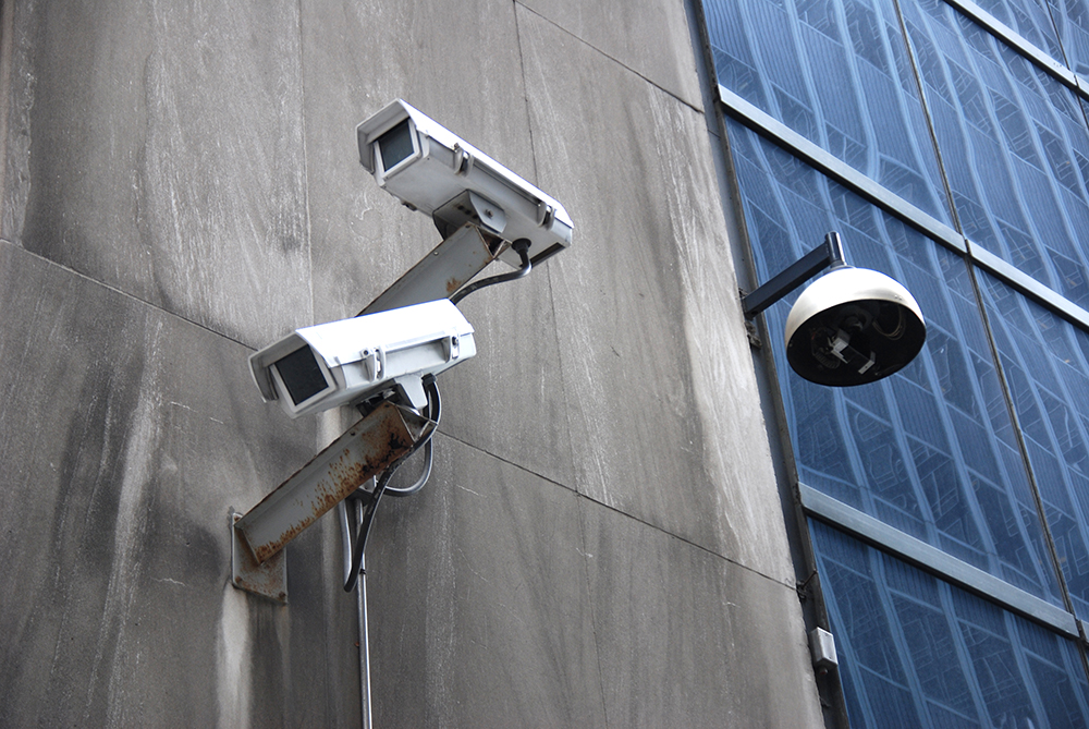 Surveillance cameras. Photo by Jonathan McIntosh/Creative Commons