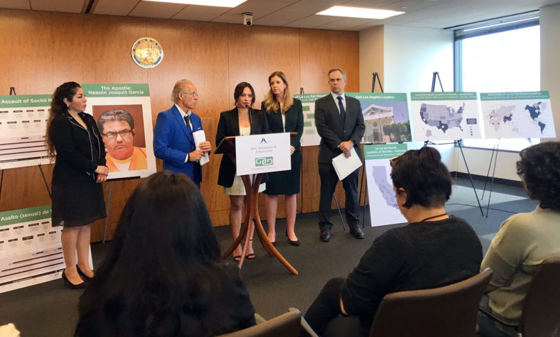 Sochil Martin, center, speaks at a news conference Feb. 13, 2020, in downtown Los Angeles about the sexual abuse she says she endured while she was a member of La Luz Del Mundo church. RNS photo by Alejandra Molina