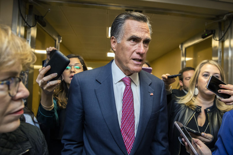 Sen. Mitt Romney, R-Utah, speaks to reporters as he arrives at the Capitol in Washington on Jan. 27, 2020, during the impeachment trial of President Donald Trump on charges of abuse of power and obstruction of Congress. (AP Photo/Manuel Balce Ceneta)