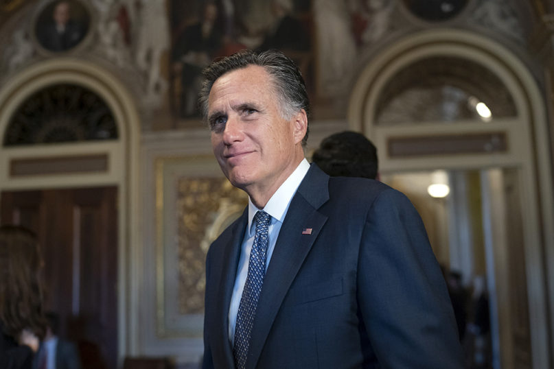 Sen. Mitt Romney, R-Utah, pauses as he speaks to a reporter outside the Senate chamber during a break in President Donald Trump's impeachment trial, at the Capitol in Washington, on Jan. 29, 2020. (AP Photo/J. Scott Applewhite)