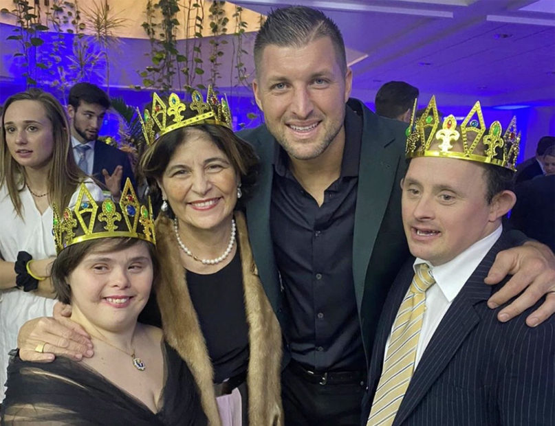 Tim Tebow poses with attendees at the Night to Shine prom event at the Pontifical University Regina Apostolorum in Rome, Feb. 4, 2020. Photo courtesy of Tim Tebow Foundation