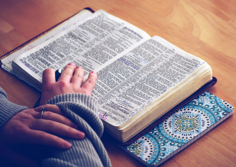 A woman reads the Book of Psalms. Photo courtesy of Creative Commons