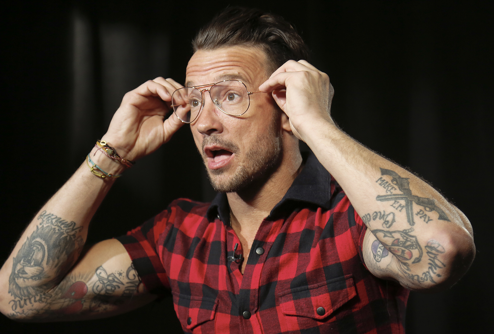 In this Oct. 23, 2017, photo, Carl Lentz, a pastor who ministers to thousands at his Hillsong Church in New York, appears during an interview, in New York. (AP Photo/Bebeto Matthews)