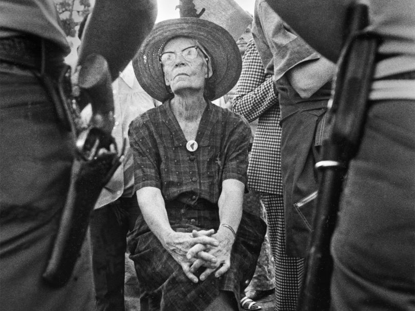 Dorothy Day sits in protest as police stand by. Photo by Bob Fitch, courtesy of Journey Films