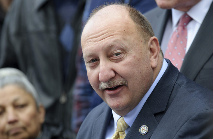 In this March 8, 2018, file photo, Allentown Mayor Ed Pawlowski announces his resignation during a news conference outside his home in Allentown, Pennsylvania. Pawlowski, serving a 15-year prison sentence for public corruption, told a newspaper his life behind bars is “kind of like being mayor but for a lot less money.”  Pawlowski has spent more than a year at a low-security prison camp in Danbury, Connecticut, after his sentencing in October 2018. (AP Photo/Matt Smith, File)