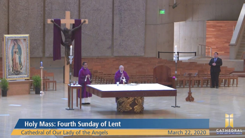 Archbishop José H. Gomez, center, leads a livestreamed Mass from an empty Cathedral of Our Lady of the Angels, Sunday, March 22, 2020, in Los Angeles. Video screengrab