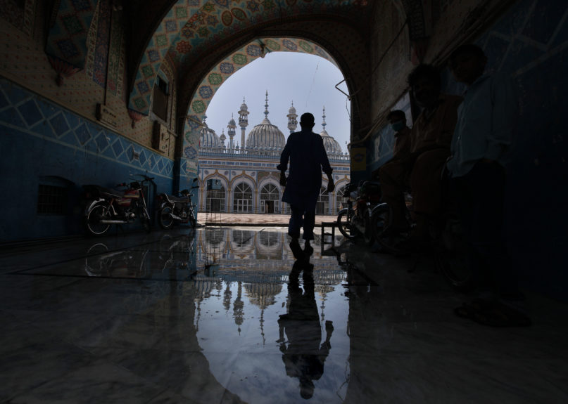 A Muslim worshipper arrives to attend noon prayers at a mosque, in Rawalpindi, Pakistan on April 21, 2020. Ramadan begins with the new moon later this week, Muslims all around the world are trying to work out how to maintain the many cherished rituals of Islam's holiest month. (AP Photo/Anjum Naveed)