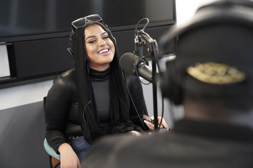 In this Dec. 19, 2019, photo, Amani Al-Khatahtbeh, founder of MuslimGirl.com, records a podcast pilot at Spotify's headquarters in New York. (AP Photo/Emily Leshner)