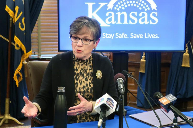 Kansas Gov. Laura Kelly answers questions about the state’s response to the coronavirus pandemic during a news conference April 15, 2020, at the Statehouse in Topeka, Kansas. Kelly has extended a statewide stay-at-home order through May 3, 2020. (AP Photo/John Hanna)