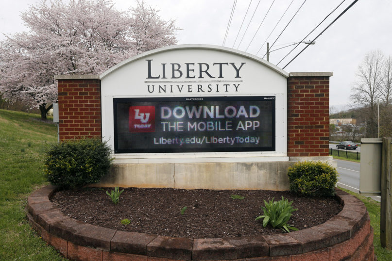A sign marks an entrance to Liberty University in Lynchburg, Virginia, March 24, 2020. (AP Photo/Steve Helber, File)