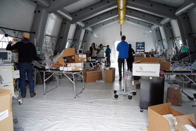 Workers prepare a 68-bed Samaritan's Purse emergency field hospital specially equipped with a respiratory unit in New York's Central Park, March 30, 2020.  Photo by Moskowitz/Globe/MediaPunch/IPX