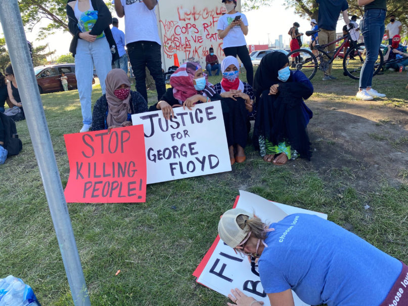 People make and display signs while protesting the death of George Floyd in Minneapolis, Minnesota, Thursday, May 28, 2020. Photo by Doug Pagitt