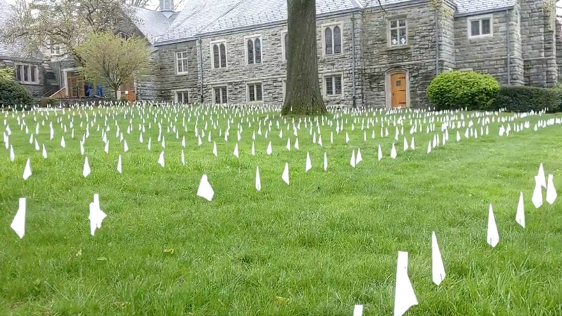 Pastor Patrick Collins has placed a white flag on the front lawn of the First Congregational Church in Old Greenwich, Connecticut, in honor of every COVID-19 victim in the state. Video creengrab via Paul P. Murphy