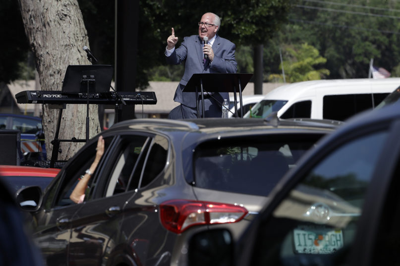 Pastor Bill Bailey preaches to his congregation during a drive-in Easter service at the Happy Gospel Center Church in Bradenton, Florida, on April 12, 2020. (AP Photo/Chris O'Meara, File)