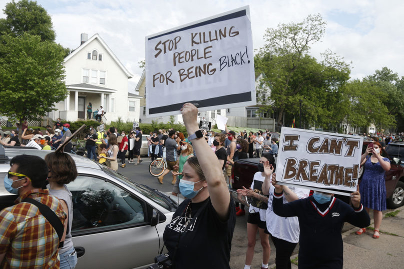 Hundreds of protesters gather May 26, 2020, near the site of the arrest of George Floyd, who died in police custody Monday night in Minneapolis, after video shared online by a bystander showed a white officer kneeling on his neck during his arrest as Floyd pleaded that he couldn't breathe. (AP Photo/Jim Mone)