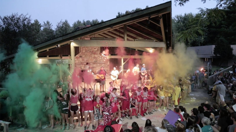 Campers throw colored chalk into the air during an event at URJ Olin-Sang-Ruby Union Institute in Oconomowoc, Wisconsin. A recent report was released discussing reports of sexual misconduct over the last 50 years around the nation. Video screen grab