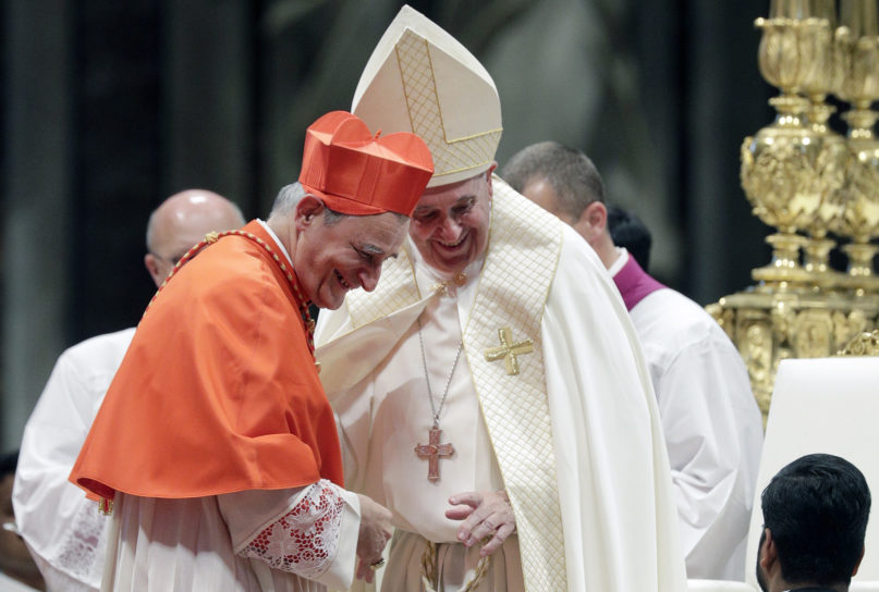 New Cardinal Matteo Maria Zuppi shares a smile with Pope Francis during a consistory inside St. Peter’s Basilica, at the Vatican, on Oct. 5, 2019. (AP Photo/Andrew Medichini)