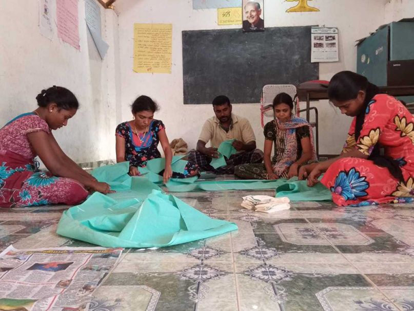 In Tamil Nadu, India, graduates of our life skills programme sew face masks for staff and volunteers. Courtesy of Jesuit Refugee Service.