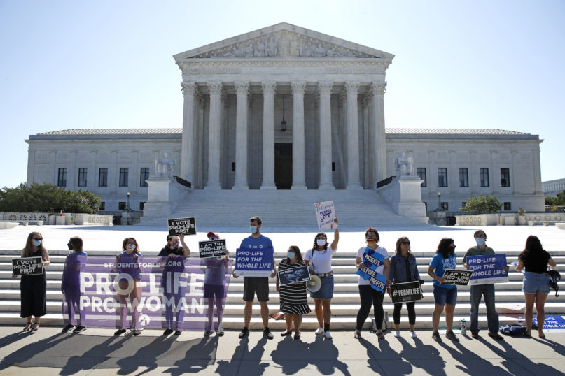 Anti-abortion protesters wait outside the Supreme Court for a decision, Monday, June 29, 2020 in Washington on the Louisiana case, Russo v. June Medical Services LLC. (AP Photo/Patrick Semansky)