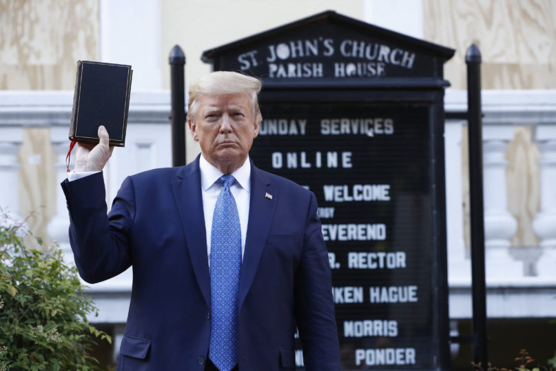 President Donald Trump holds a Bible as he visits outside St. John's Church across Lafayette Park from the White House on June 1, 2020, in Washington. Part of the church was set on fire during protests the night before. (AP Photo/Patrick Semansky)