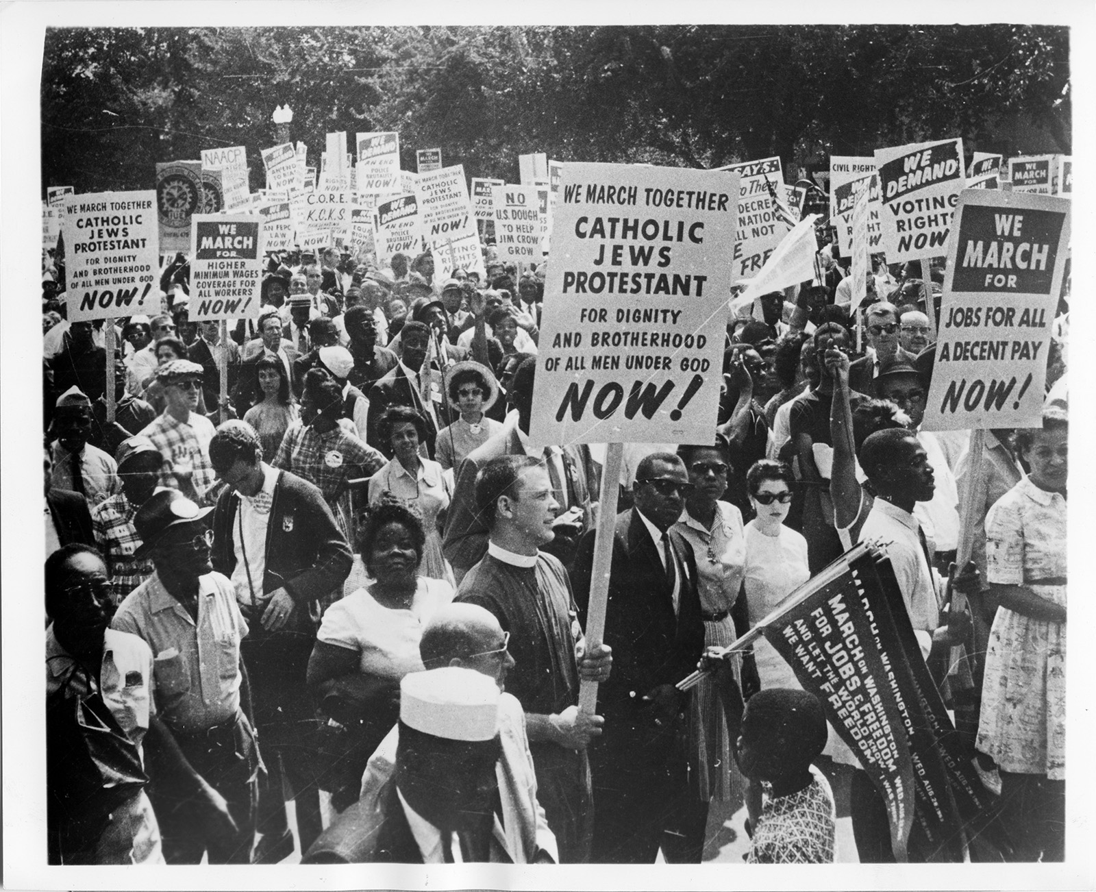 Religious participation in the March on Washington for Jobs and Freedom exceeded all expectations in 1963. In addition to many banners and signs designating specific religious groups, many churchmen and women marched as Protestants, Catholics and Jews, united in their support of full equality for all American citizens. More than half the signs in the March were those of churches, synagogues and related agencies. RNS archive photo by Seth Muse