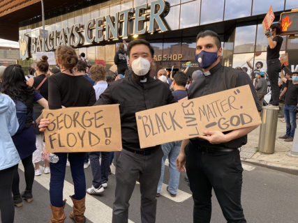 Pastors Abraham Choo, left, and Justin Adour, both of Redeemer Churches and Ministries, participate in a march in memory of George Floyd and against police brutality in Brooklyn, New York, Tuesday, June 2, 2020. RNS photo by Roxanne Stone