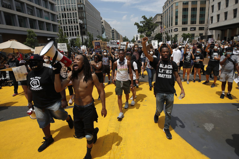 Demonstrators protest near the White House in Washington over the death of George Floyd, June 6, 2020. In just about any other year, Juneteenth is commemorated with cookouts, parades and community festivals, but Juneteenth 2020 will be a day of protest in many places this June 19. (AP Photo/Alex Brandon)