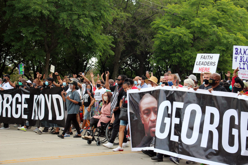 Thousands of people commemorate Juneteenth with an interfaith march against racial injustice through Grant Park in Chicago on June 19, 2020. RNS photo by Emily McFarlan Miller