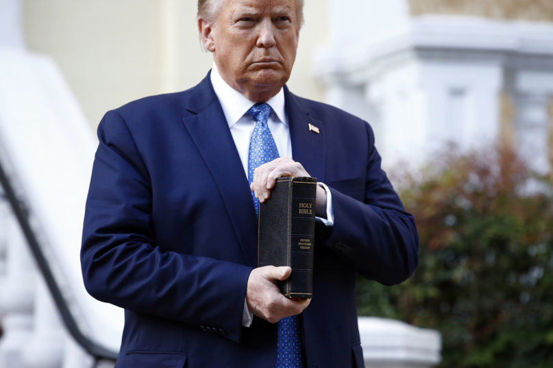 President Donald Trump holds a Bible as he visits outside St. John’s Church, across Lafayette Park from the White House, on June 1, 2020, in Washington. (AP Photo/Patrick Semansky)