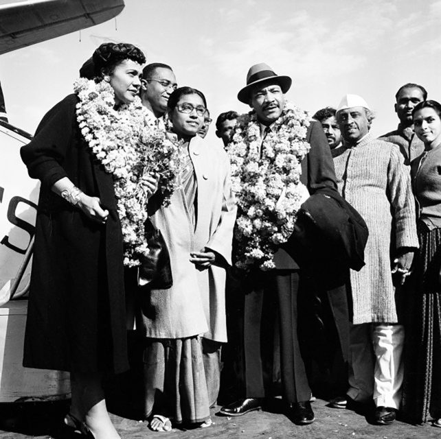 The Rev. Martin Luther King Jr. and his wife, Coretta, both wearing garlands, are received by admirers after landing at the airport in New Delhi on Feb. 10, 1959. King, who was known as the American Gandhi, went on what he called a “four-week pilgrimage in India, which to me means Mahatma Gandhi.” (AP Photo/R. Satakopan)